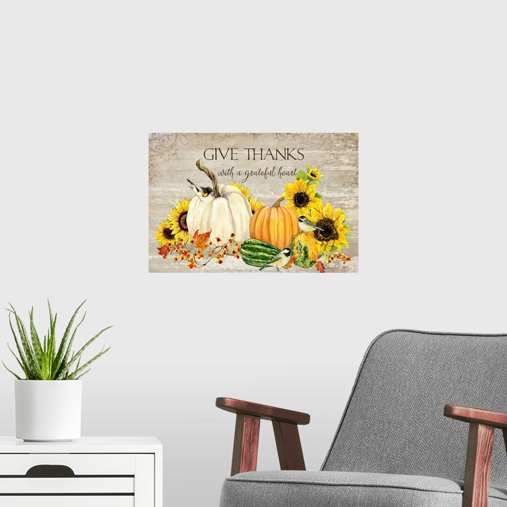 A modern room featuring Thanksgiving decor of a white pumpkin, squash, and sunflowers with small birds.