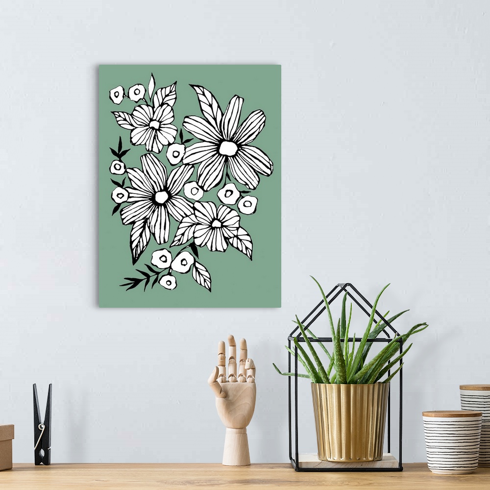 A bohemian room featuring Contemporary artwork of white flowers in a bold black outline against a muted green background.