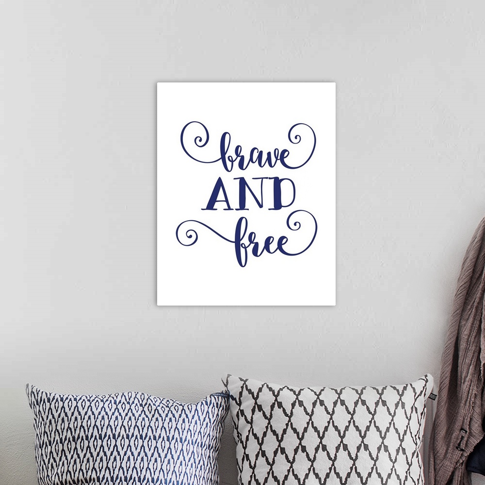 A bohemian room featuring Inspirational decor featuring the words, "Brave and free" in blue text against a white background.