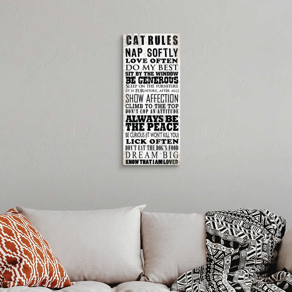 A bohemian room featuring Cat sentiments in black typography against a tan and white background.