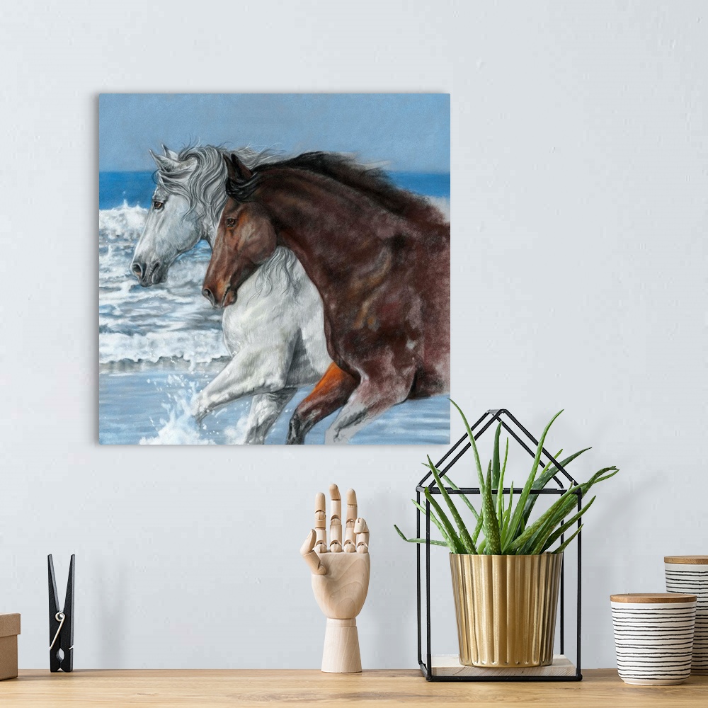 A bohemian room featuring Artwork of a white and a brown horse galloping through ocean water on a beach.