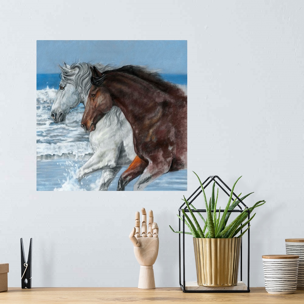 A bohemian room featuring Artwork of a white and a brown horse galloping through ocean water on a beach.