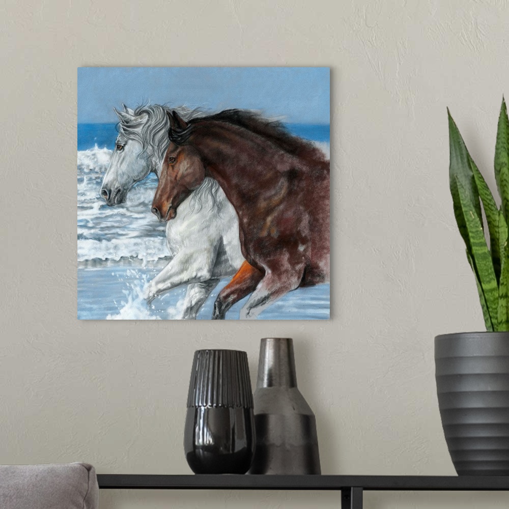 A modern room featuring Artwork of a white and a brown horse galloping through ocean water on a beach.