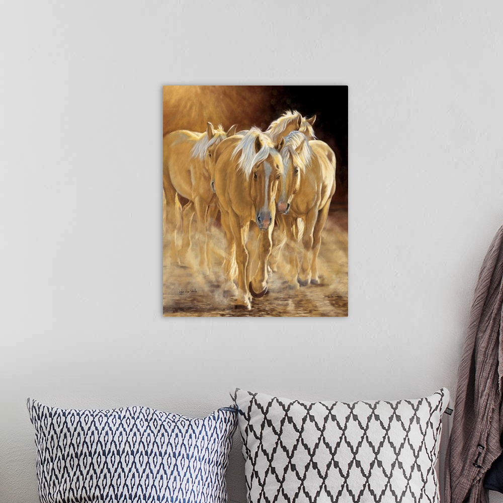 A bohemian room featuring A herd of palomino horses walking in the late afternoon light.