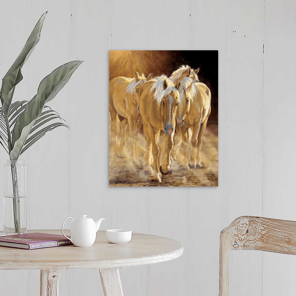 A farmhouse room featuring A herd of palomino horses walking in the late afternoon light.