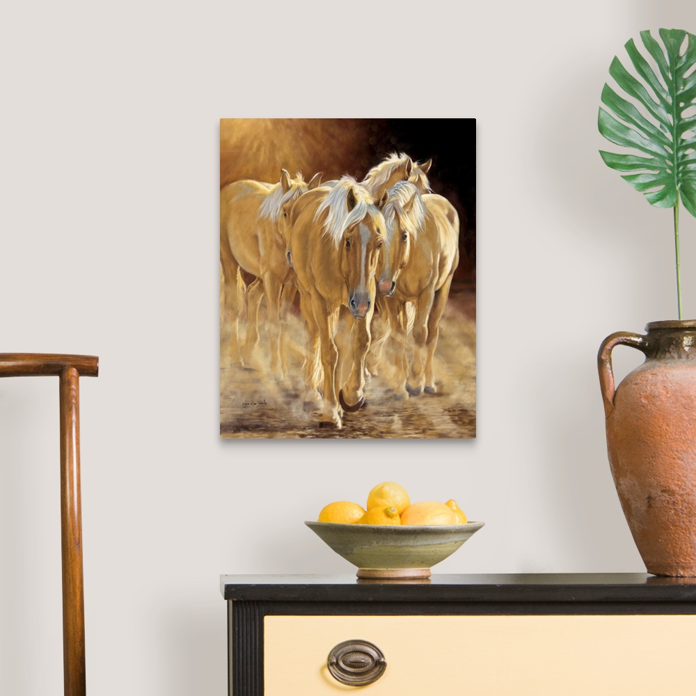 A traditional room featuring A herd of palomino horses walking in the late afternoon light.