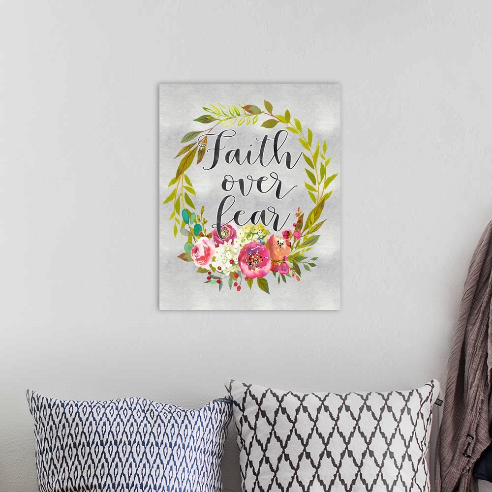 A bohemian room featuring A wreath of flowers and leaves surround the words, "Faith over fear" .