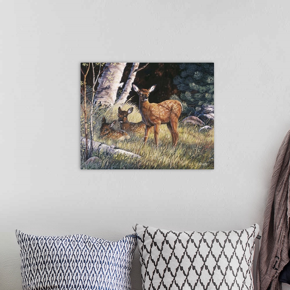 A bohemian room featuring Three newborn elk hiding in tall grass in a forest.
