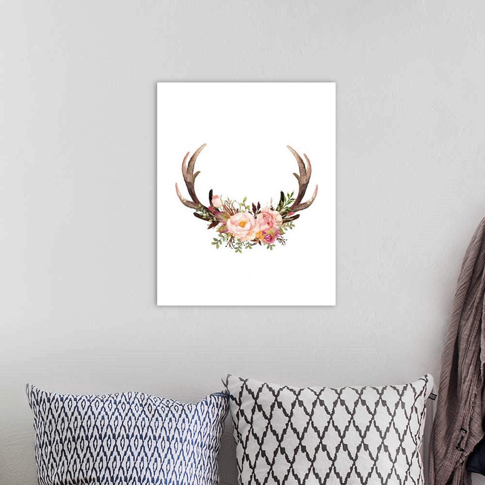 A bohemian room featuring A pair of antlers with an arrangement of watercolor flowers resting in the center.