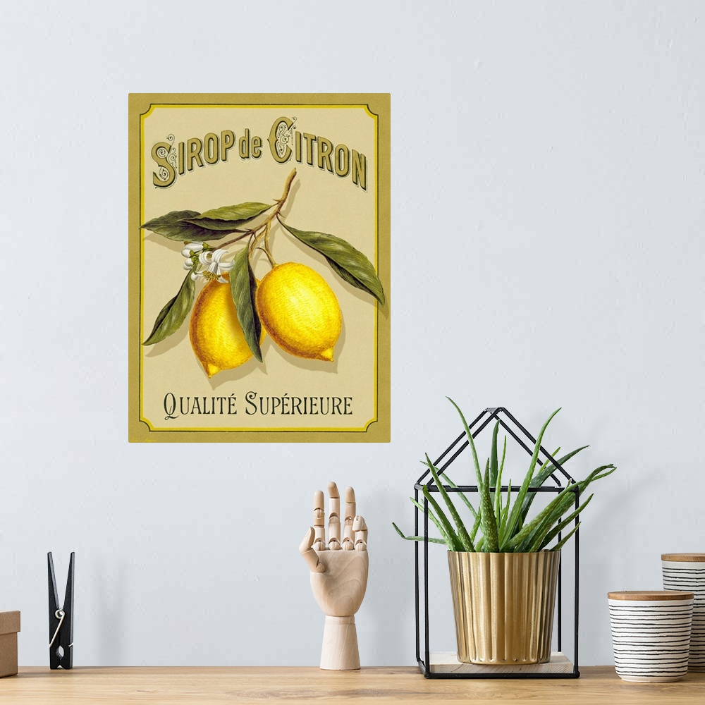 A bohemian room featuring Large print of an a French advertisement with two lemons on a branch.