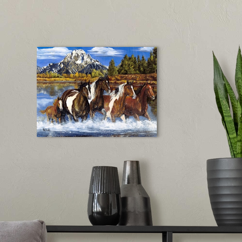 A modern room featuring Contemporary artwork of a herd of horses as they gallop through shallow water. A snow capped moun...