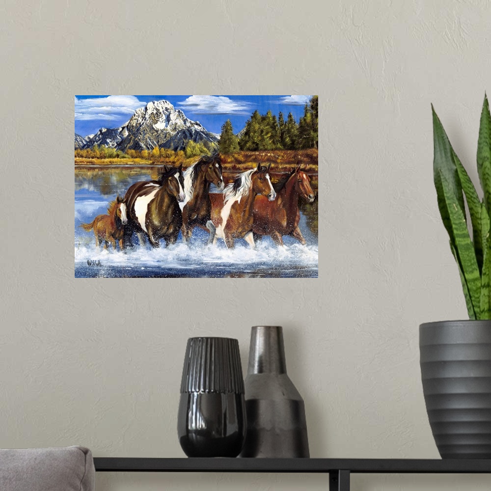 A modern room featuring Contemporary artwork of a herd of horses as they gallop through shallow water. A snow capped moun...