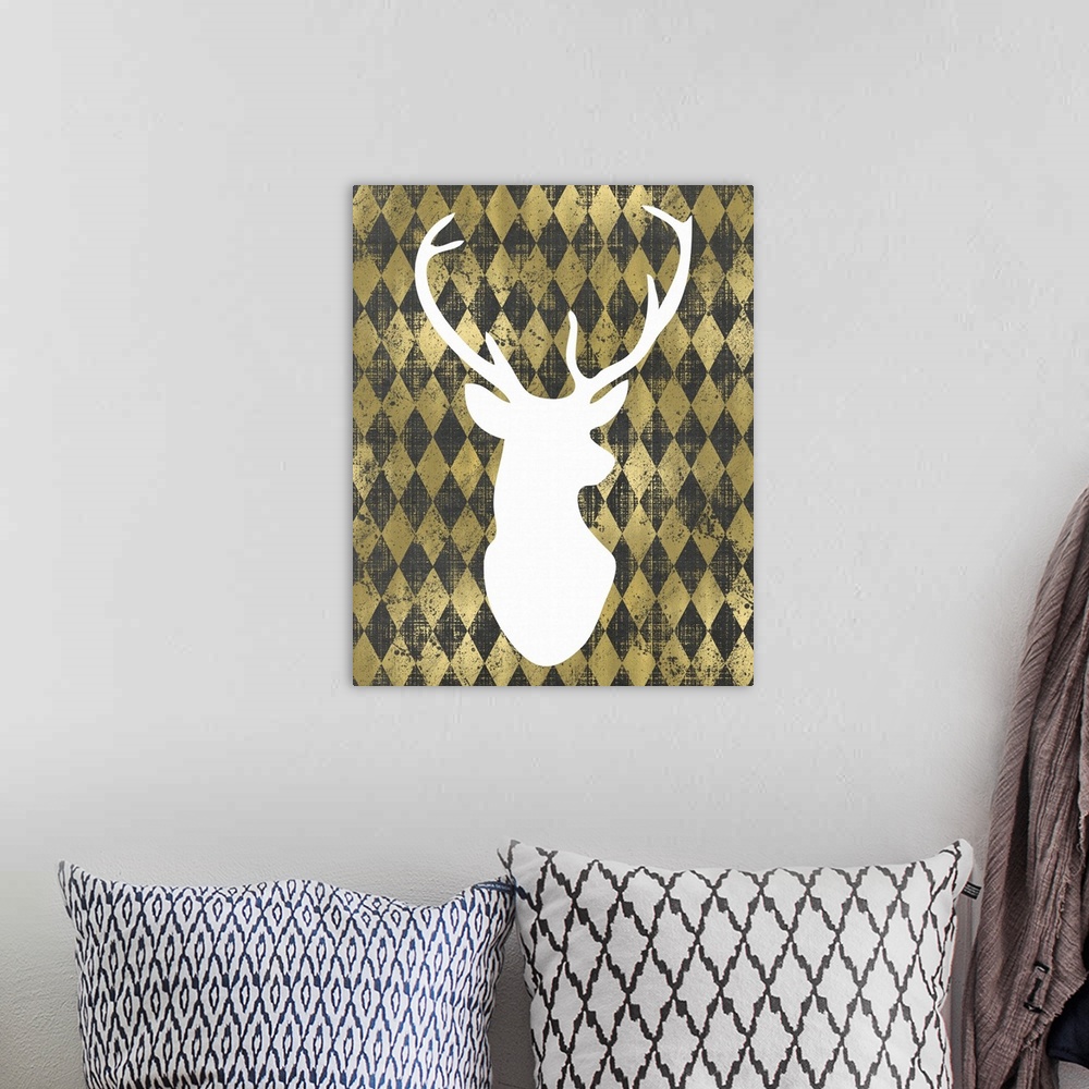 A bohemian room featuring Outline of a male deer's head in white against a gold diamond background.
