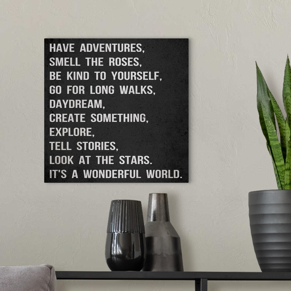 A modern room featuring Have Adventures, grey on black