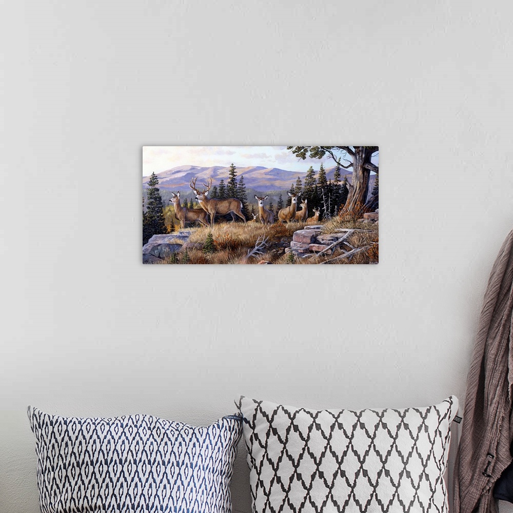 A bohemian room featuring Oversized, horizontal art of a small herd of deer standing on a grassy ledge, a line of pine tree...