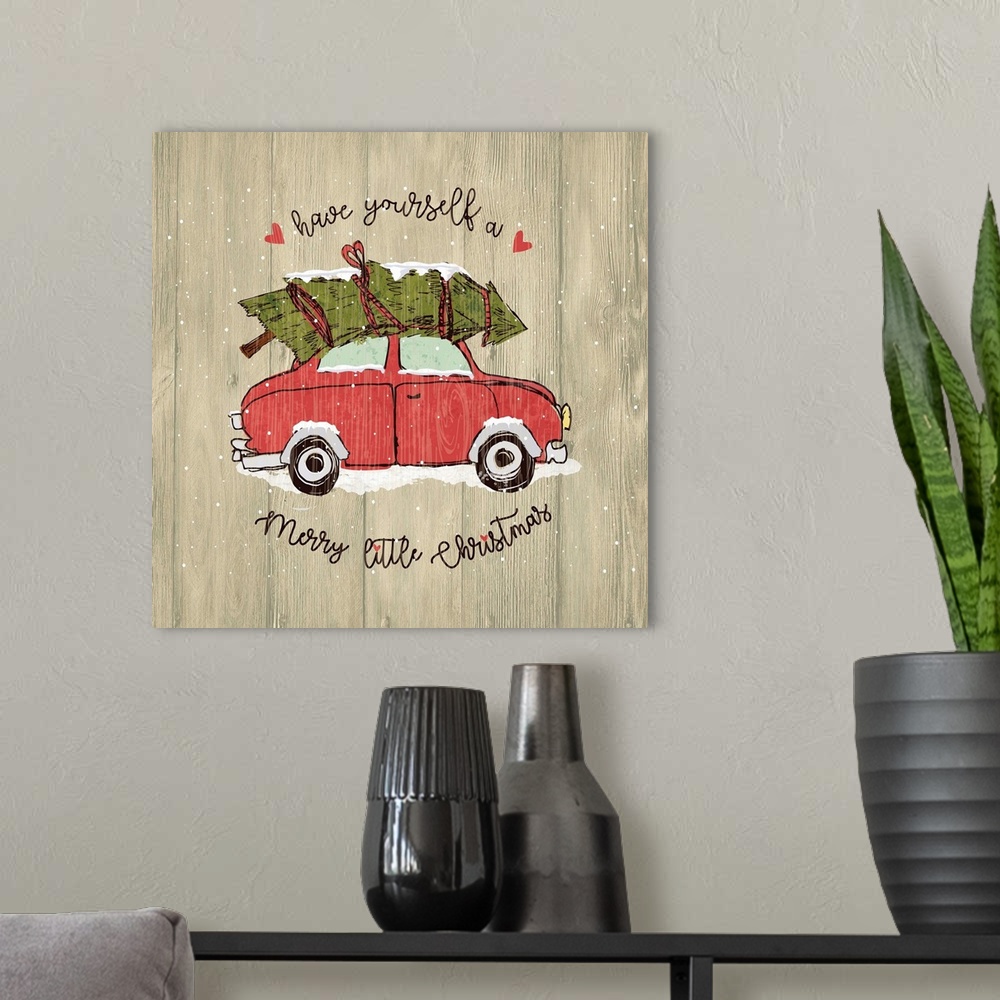 A modern room featuring Christmas decor of a car carrying a Christmas tree on a wooden background.