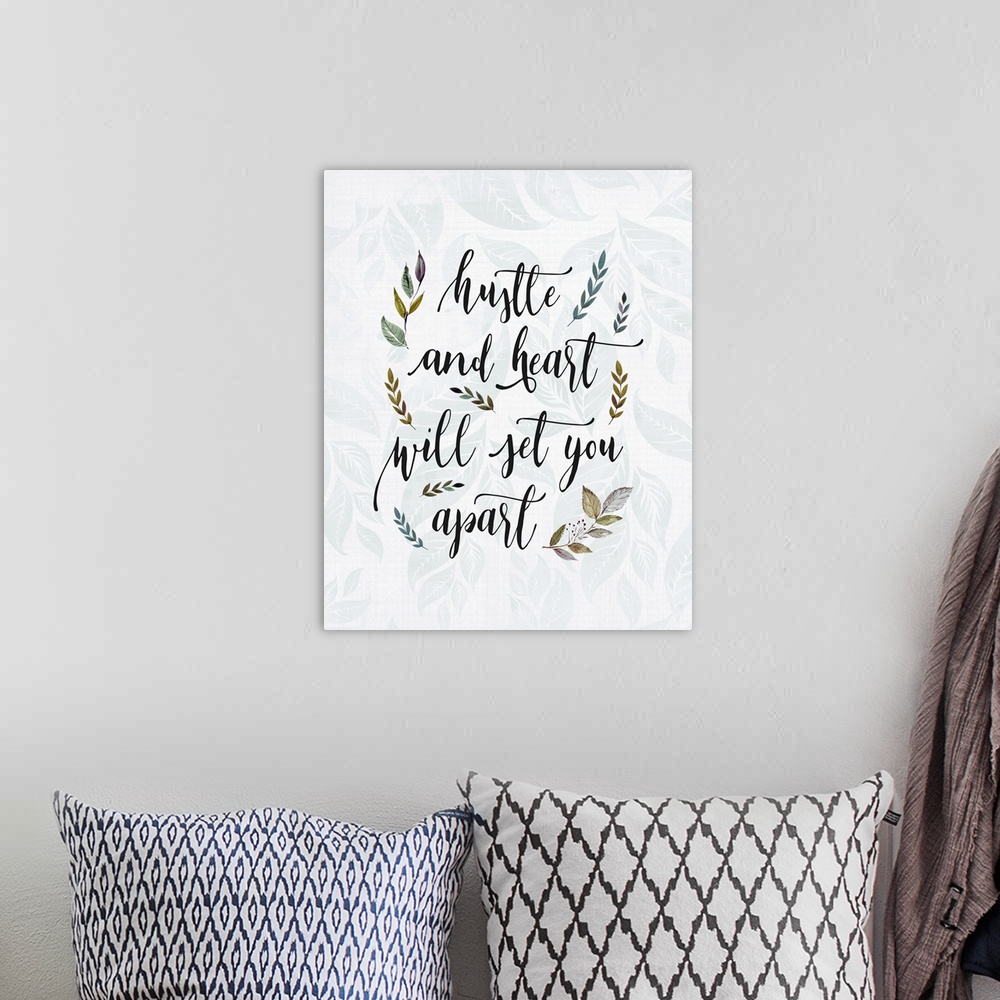 A bohemian room featuring Textual art of an inspirational statement in a script font, surrounded by branch and leaf graphic...