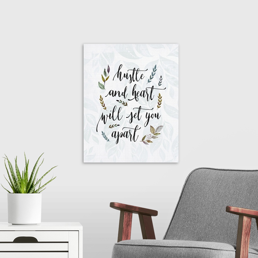 A modern room featuring Textual art of an inspirational statement in a script font, surrounded by branch and leaf graphic...