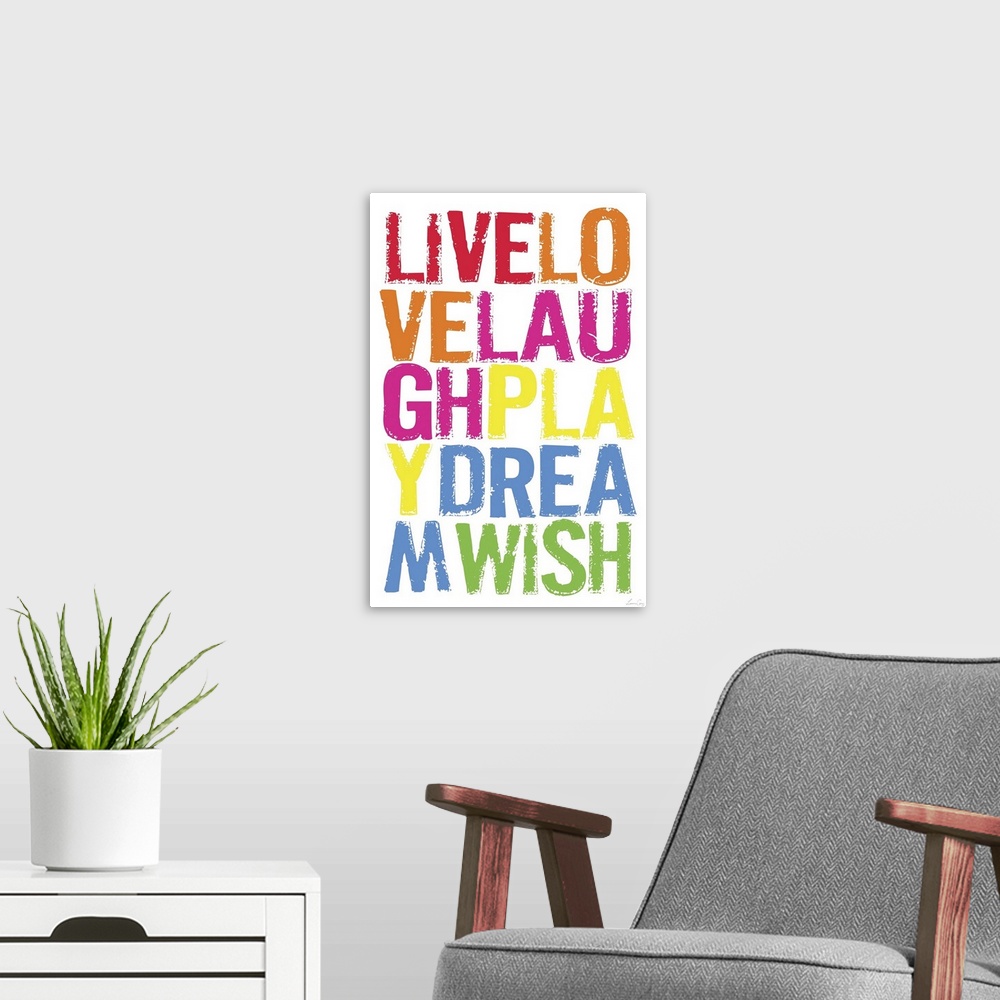 A modern room featuring Wall art of brightly colored words on top of a blank canvas.