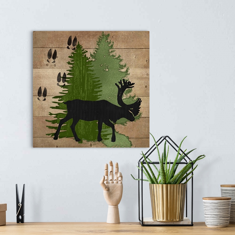 A bohemian room featuring Cabin decor of a reindeer silhouette with hoof tracks and pine trees.