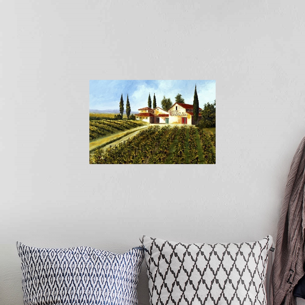 A bohemian room featuring Big painting of grape fields and a large compund on a clear, sunny day.