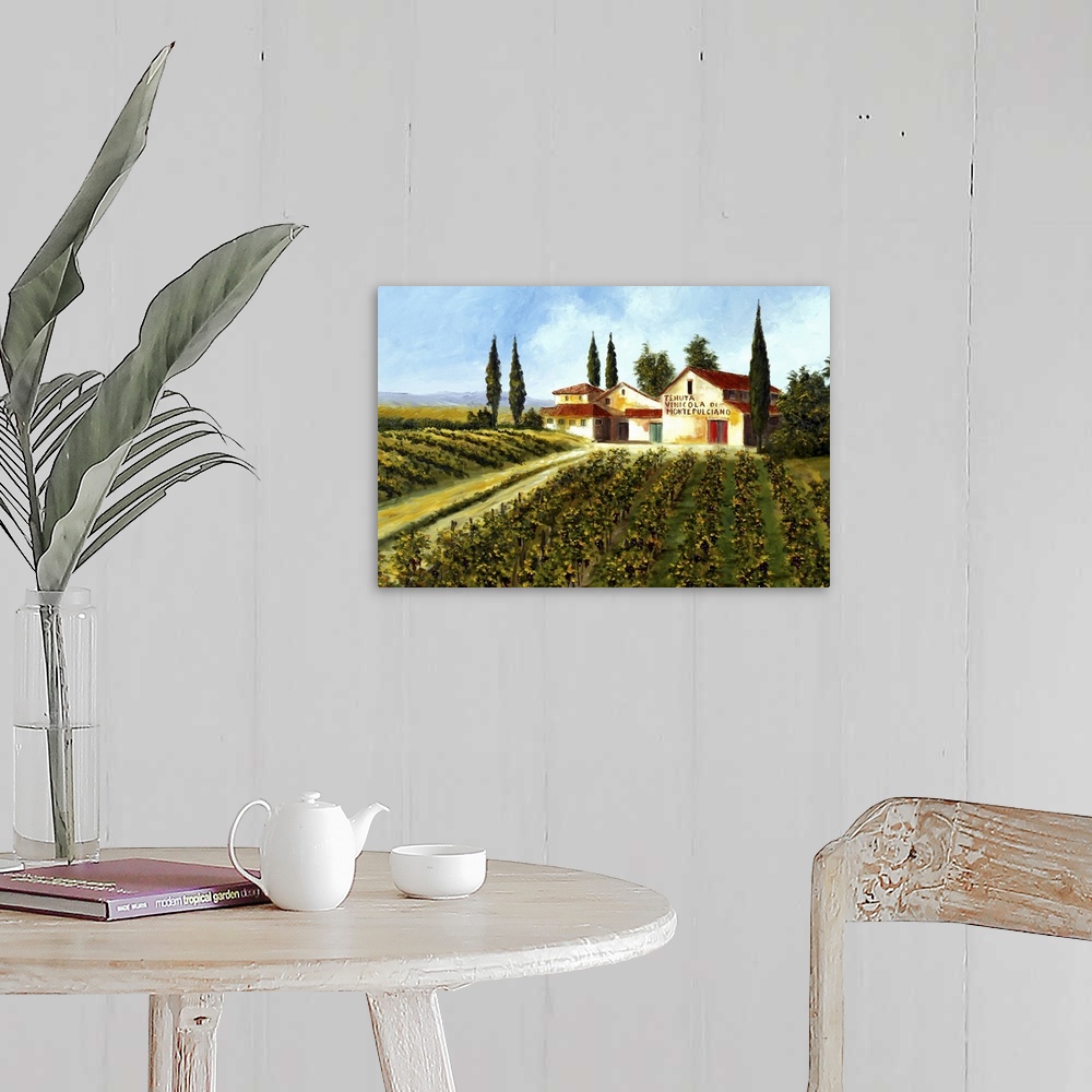 A farmhouse room featuring Big painting of grape fields and a large compund on a clear, sunny day.