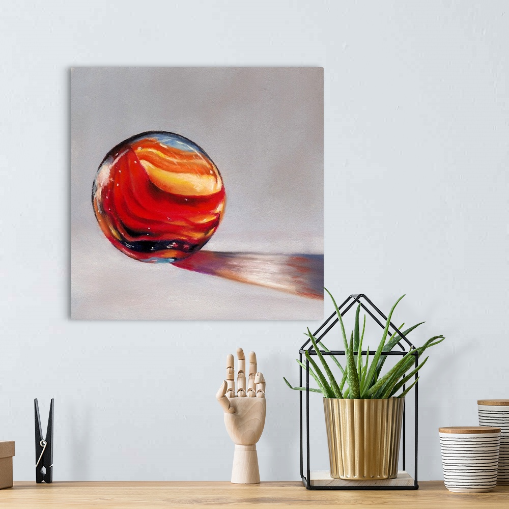 A bohemian room featuring Painting of light shining through a red marble.