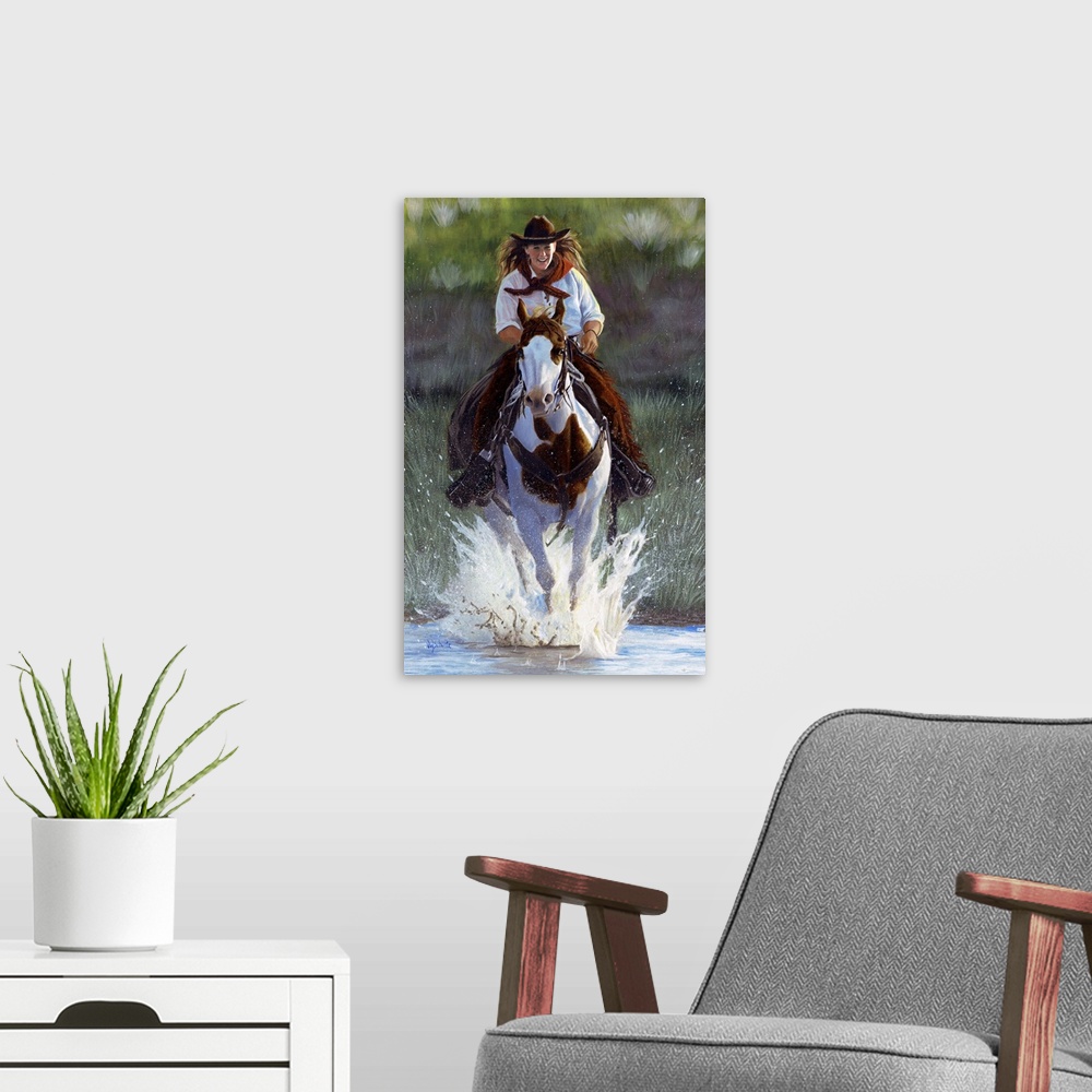 A modern room featuring Painting of a cowgirl riding a paint horse through a shallow river.