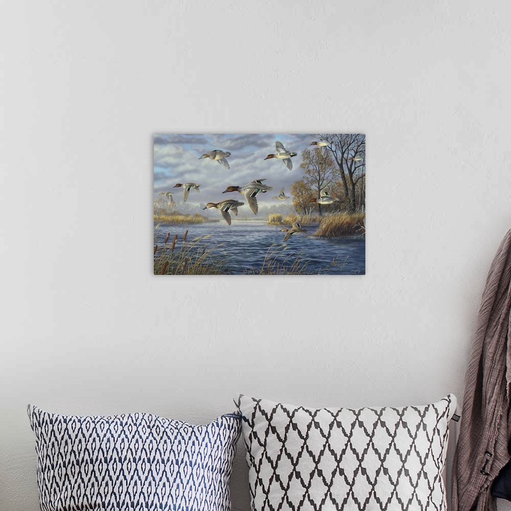 A bohemian room featuring Contemporary artwork of a flock of green-winged teals in flight over a river.