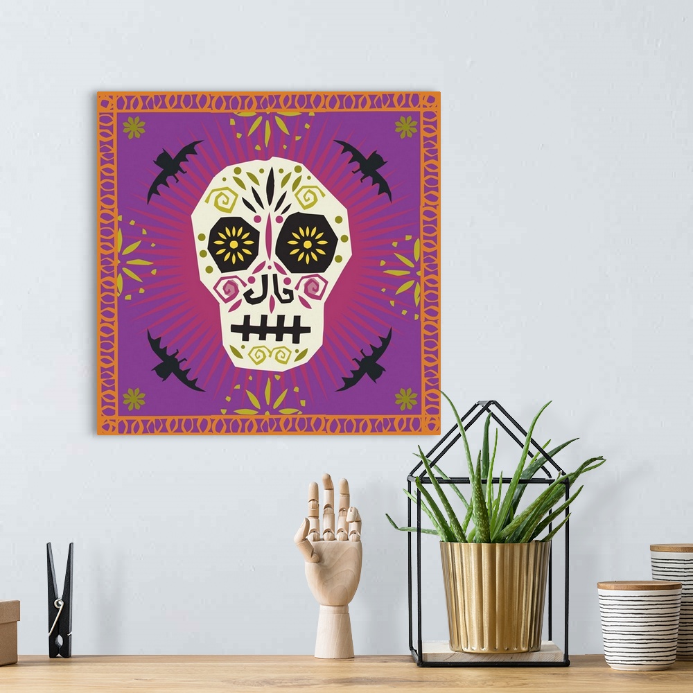 A bohemian room featuring Decorated sugar skull surrounded by bats and a decorative border.