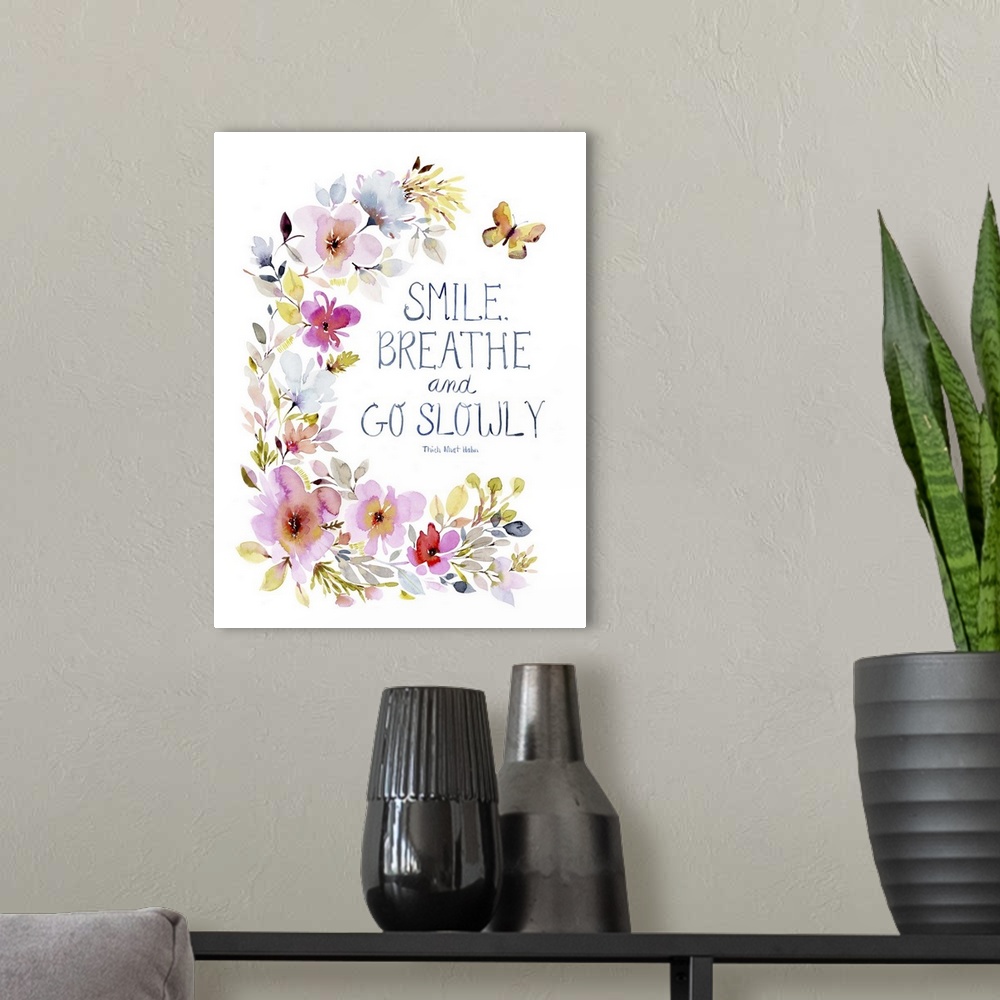 A modern room featuring Contemporary watercolor artwork of a sentiment surrounded by bright flowers.