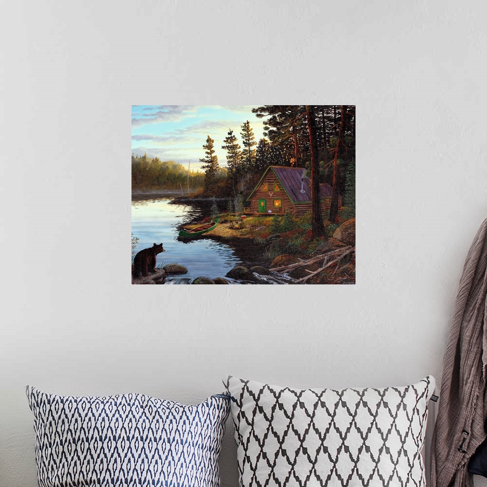 A bohemian room featuring Photograph of cabin in the woods by lake with canoe under a cloudy sky.  There is a bear on the o...