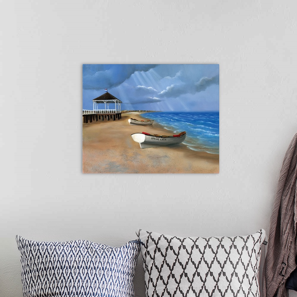 A bohemian room featuring Painting of boats on the sand by a pier on the coast.