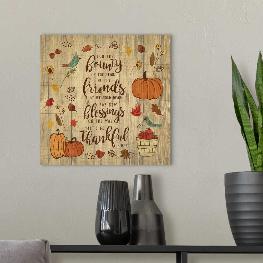 A modern room featuring Thanksgiving themed decor of pumpkins, leaves, and birds surrounding a thankful prayer.