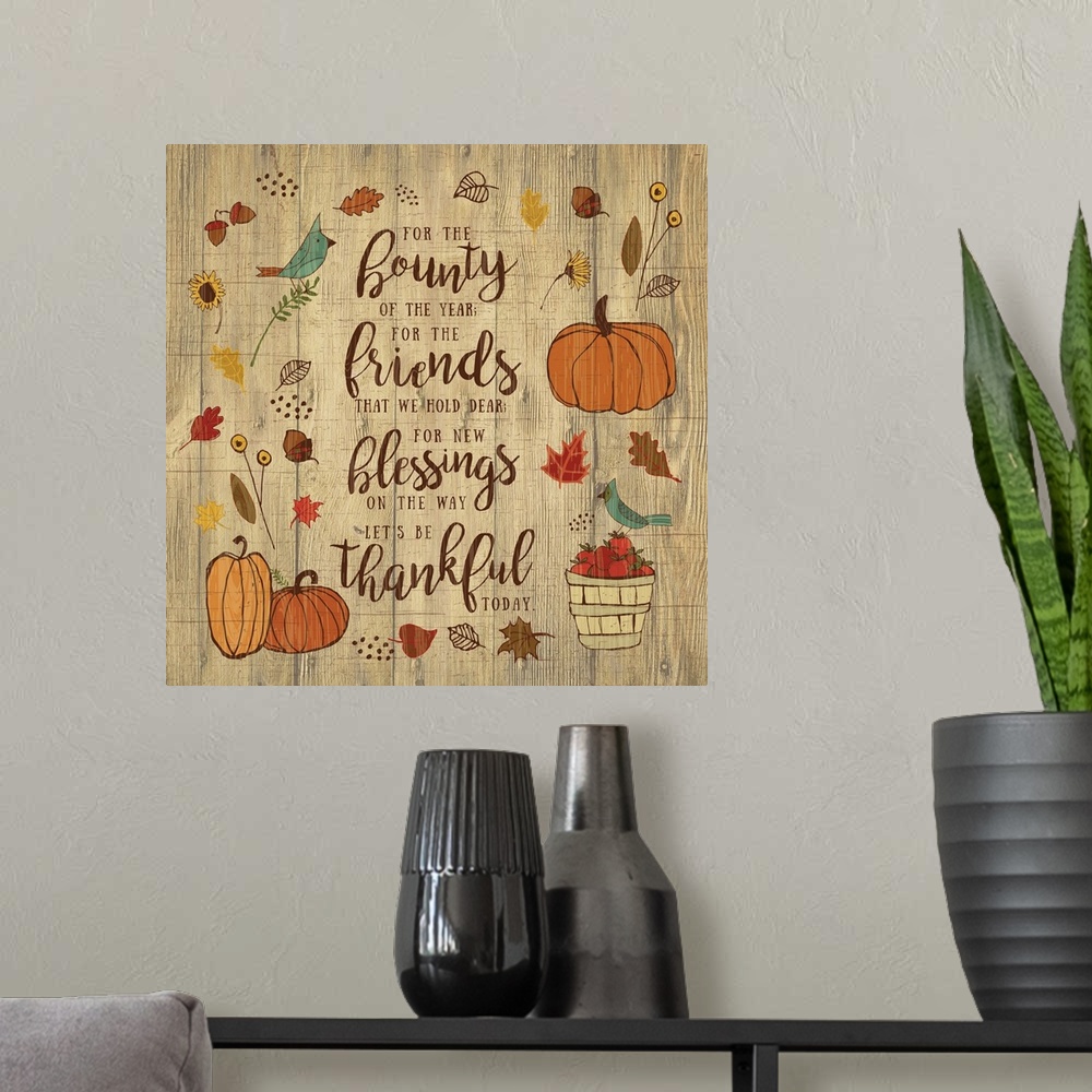 A modern room featuring Thanksgiving themed decor of pumpkins, leaves, and birds surrounding a thankful prayer.