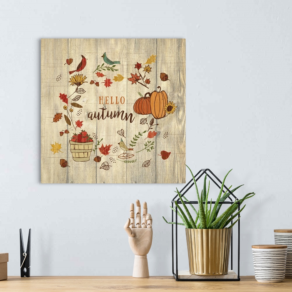 A bohemian room featuring Thanksgiving themed decor of pumpkins, a basket of apples, fall leaves, and birds.