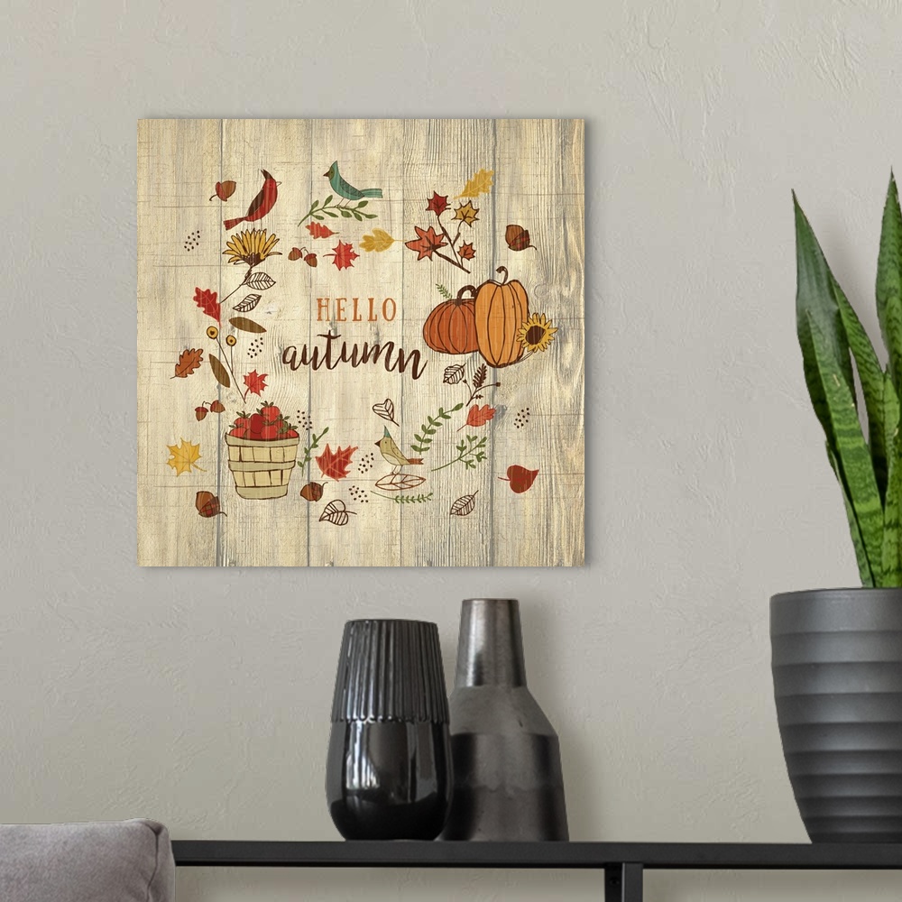 A modern room featuring Thanksgiving themed decor of pumpkins, a basket of apples, fall leaves, and birds.