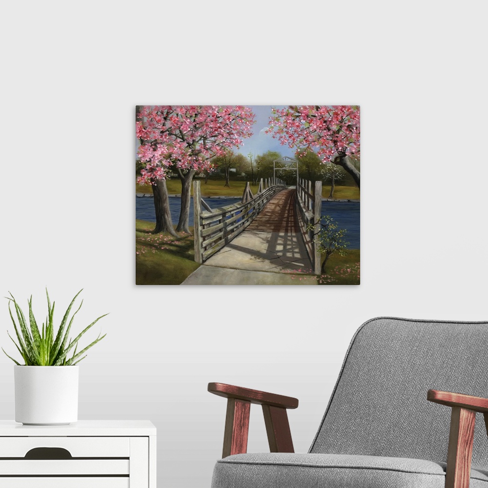 A modern room featuring A wooden bridge across a river under blossoming trees.
