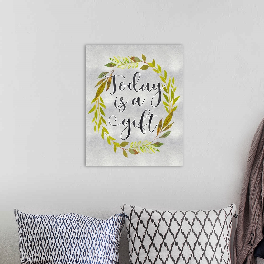 A bohemian room featuring A wreath of leaves surround the words, "Today is a gift" .