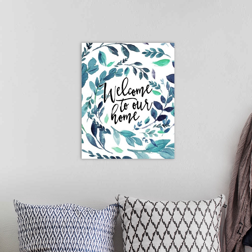 A bohemian room featuring Handlettered decor featuring the message, "Welcome to our home" in black text placed on a white b...