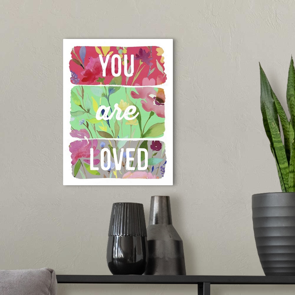 A modern room featuring You are Loved planks