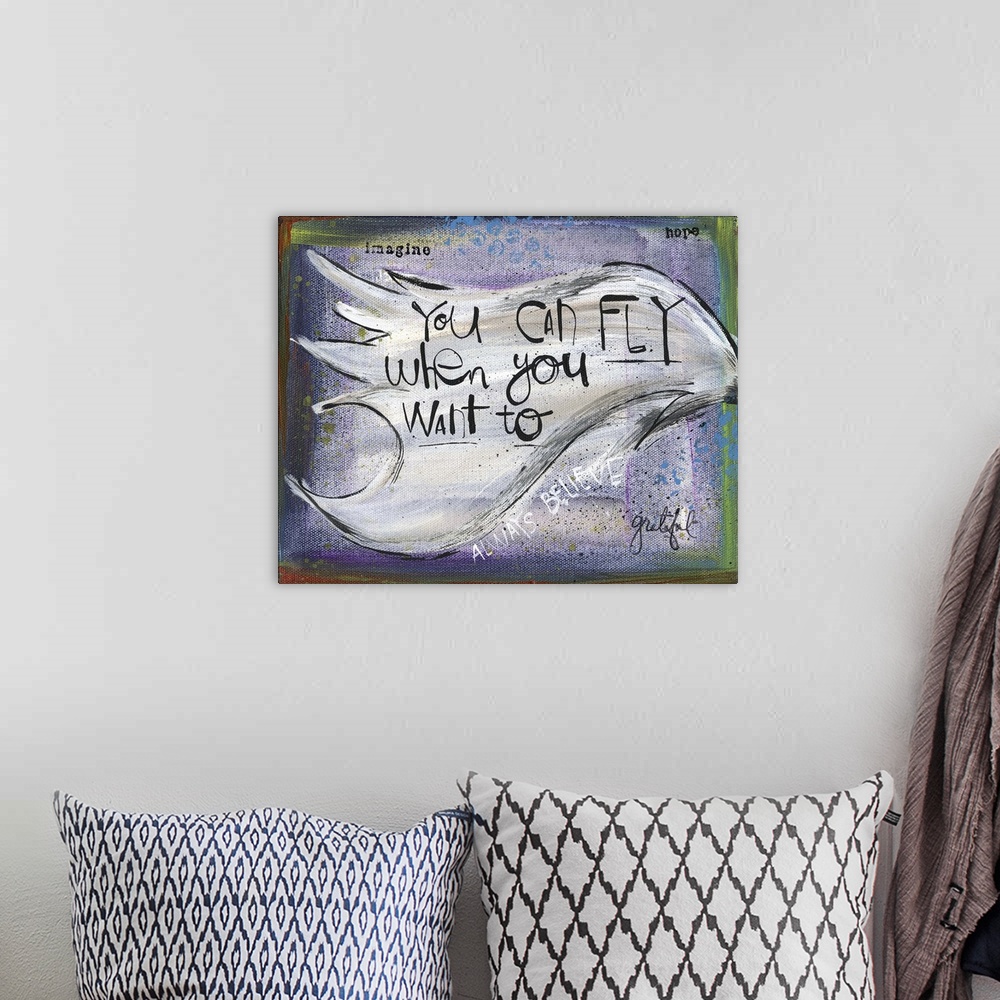 A bohemian room featuring "You can fly when you want to" handwritten on a wing.