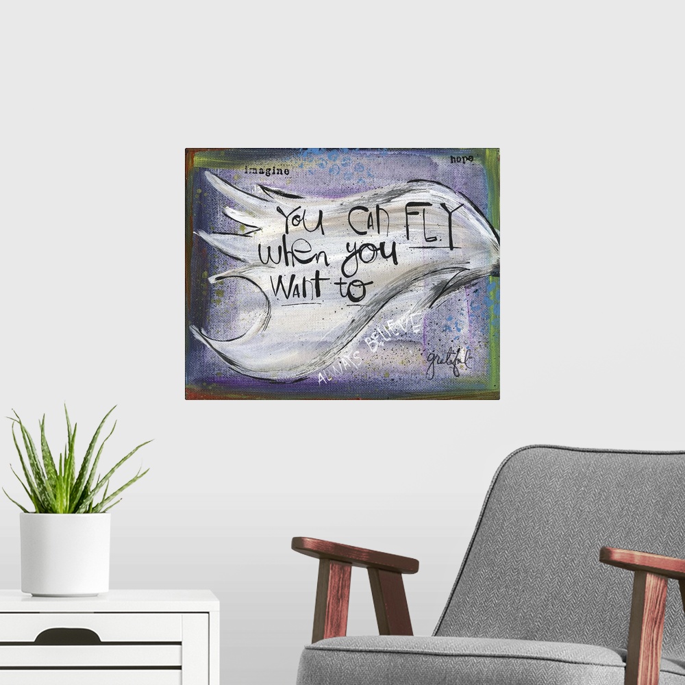 A modern room featuring "You can fly when you want to" handwritten on a wing.