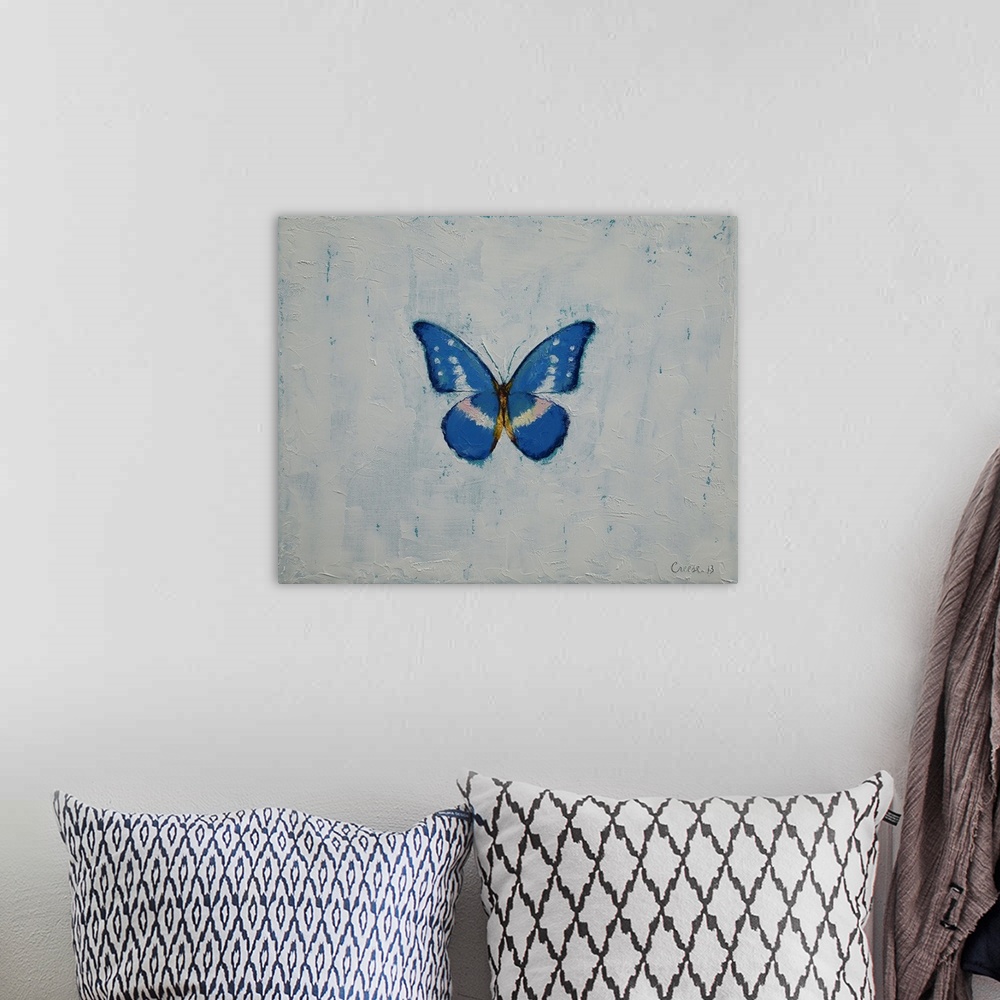 A bohemian room featuring A contemporary painting of a blue and white butterfly against a white background.