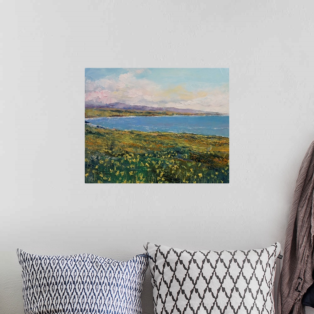 A bohemian room featuring A contemporary painting of a coastal Californian landscape.