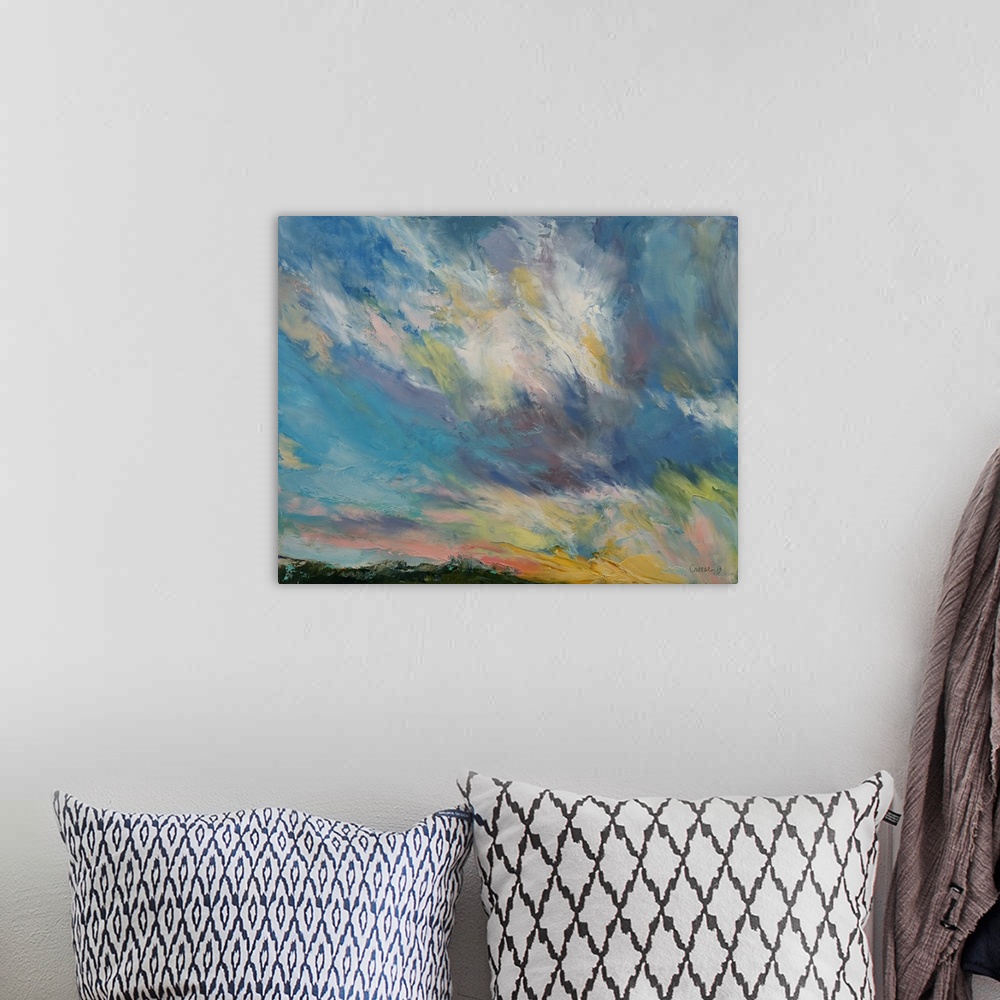 A bohemian room featuring A contemporary painting of a colorful skyscape.