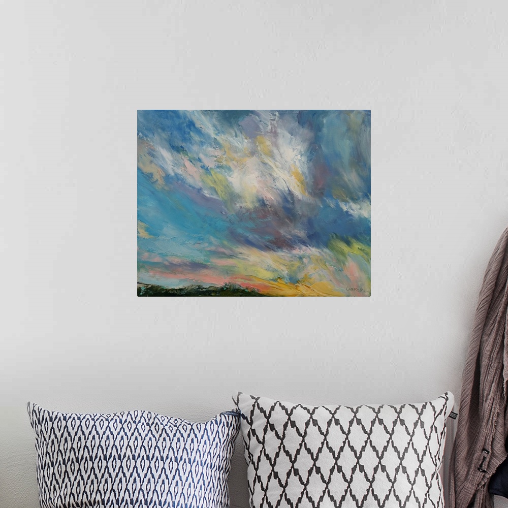 A bohemian room featuring A contemporary painting of a colorful skyscape.