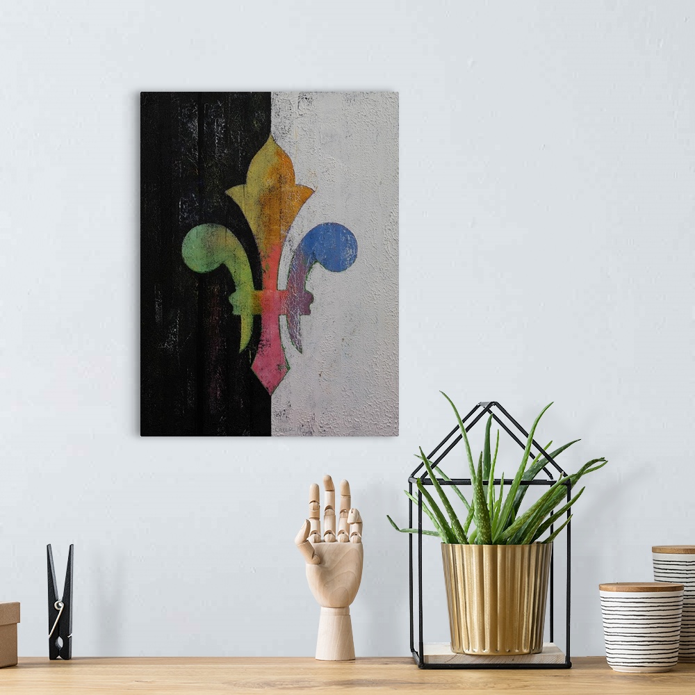 A bohemian room featuring A contemporary painting of a colorful symbol against a split black and white background.