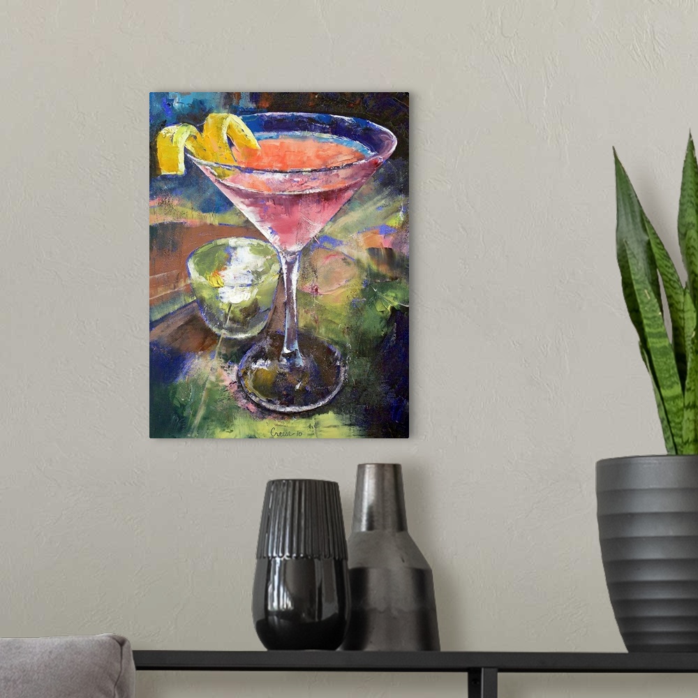 A modern room featuring Large artwork of a martini glass filled with a pink drink and a lemon twist on the side. A small ...