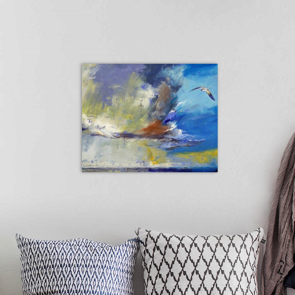 A bohemian room featuring Big contemporary art portrays a lone bird flying over an open body of water on a sunny day.
